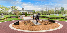 Special landscaping feature of a horse statue and a pavilion in the background  at Resthaven Memorial Park.