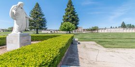 Special landscaping feature of a statue of Jesus at Mount Vernon Memorial Park & Mortuary.