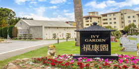 Ivy garden with mausoleum in the background at Woodlawn Memorial Park. 