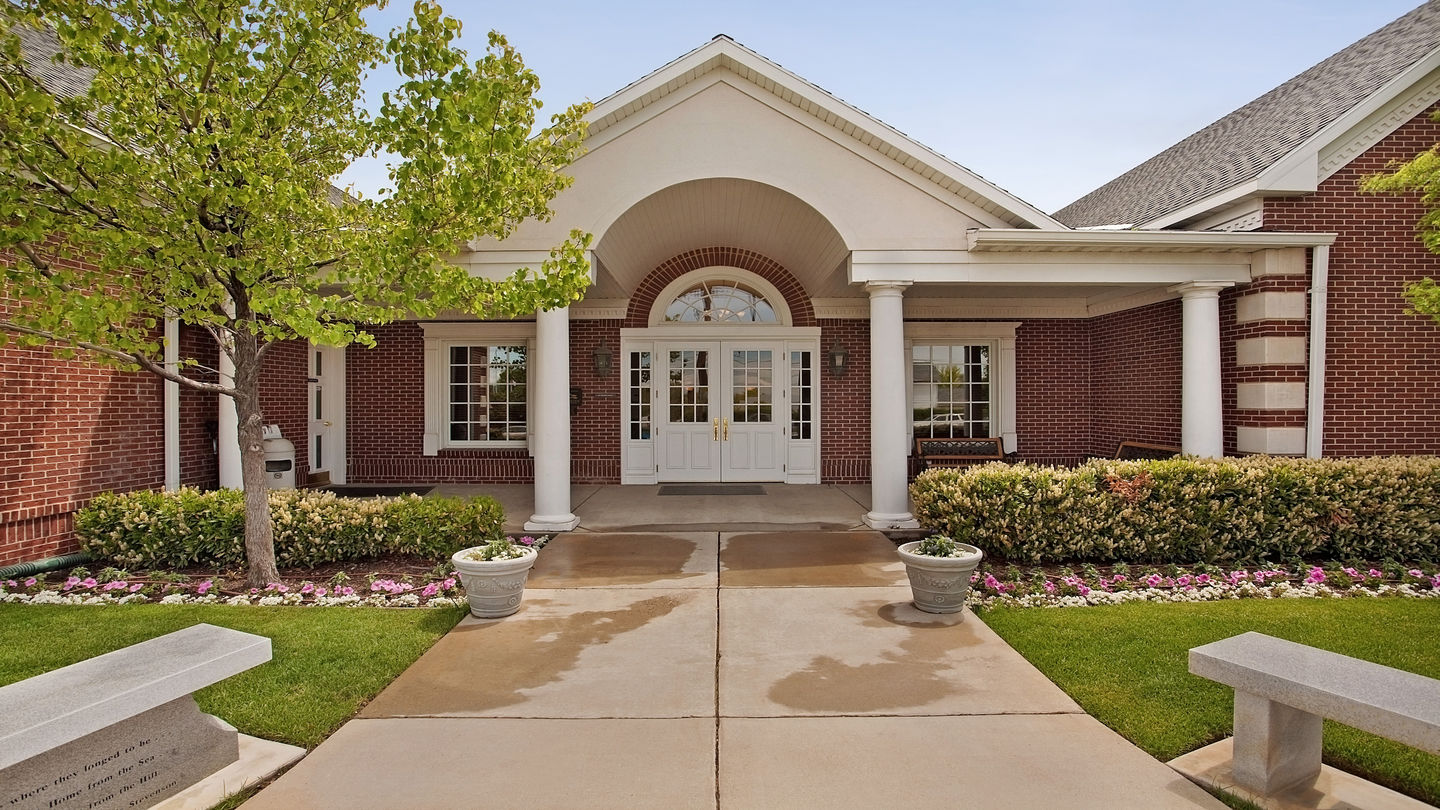 Valley View Funeral Home features a beautiful red brick exterior and traditional white columns
