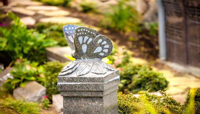 A custom butterfly cremation pedestal at Chapel Hill Gardens South Cemetery.