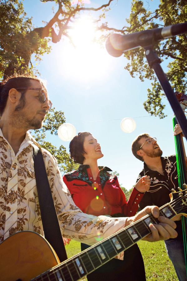 A group of musicians playing and singing 