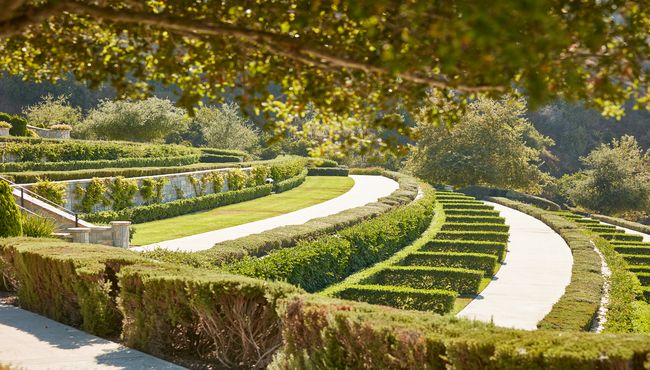 Tiered hedge estates with beautiful landscaping at Rose Hills. 