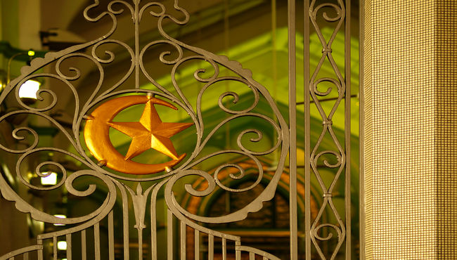 A gate with the star and crescent of Islam. 