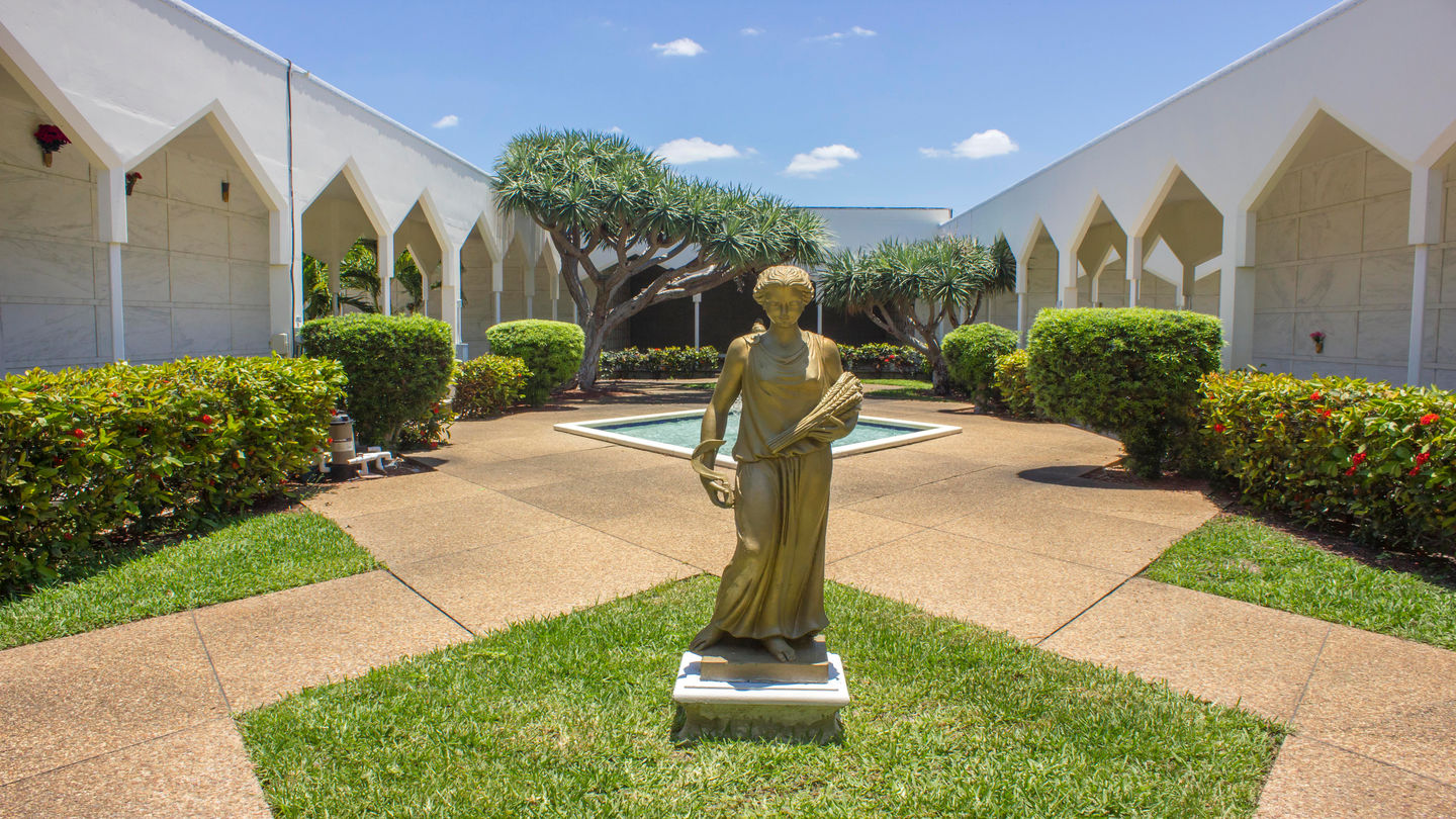 Golden statue of a women in the mausoleum at Forest Lawn Memorial Gardens.
