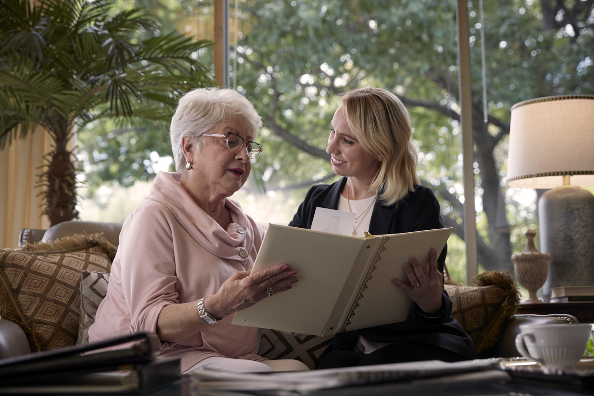 An associate helps with select photos of a loved-one.