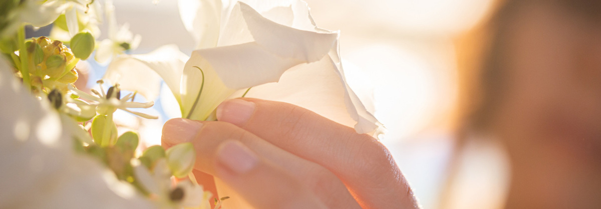 close up of hand fixing flower 