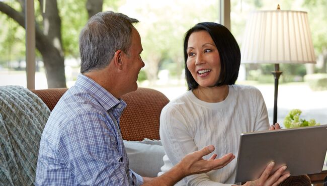 A couple pre-plans at home in the kitchen.