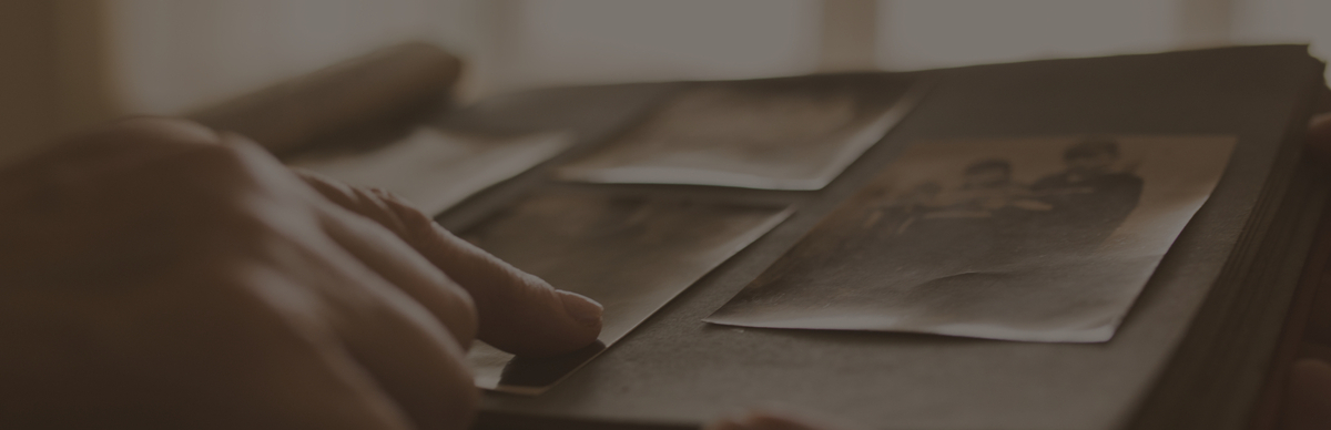 Finger pointing at photo album