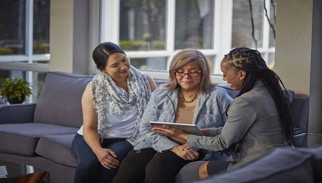 family sitting down with associate