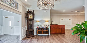 Entryway of a funeral home with a Life Well Celebrated welcome mat.