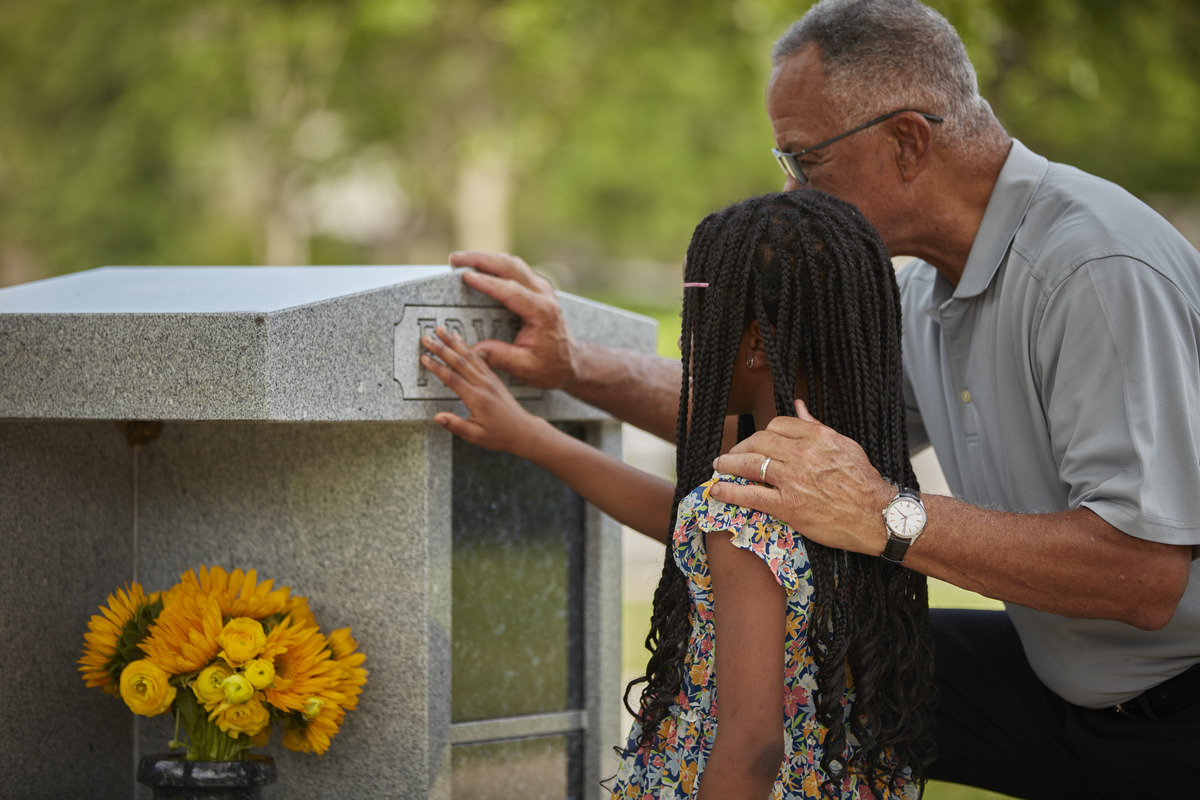 family visiting grave