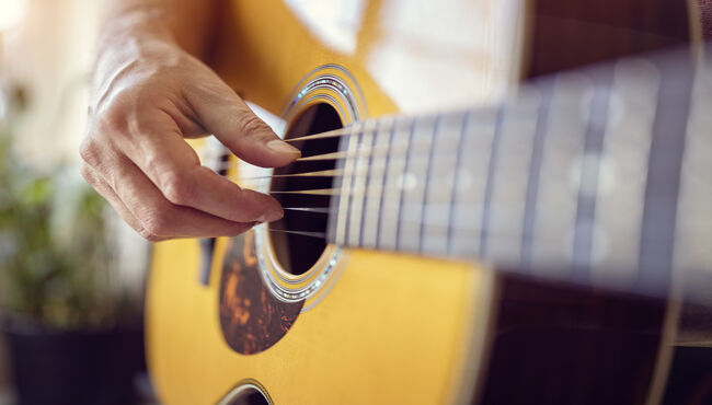 Man playing an acoustic guitar