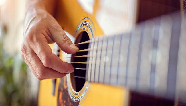 Man playing an acoustic guitar