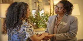 A funeral director welcomes and comforts grieving child