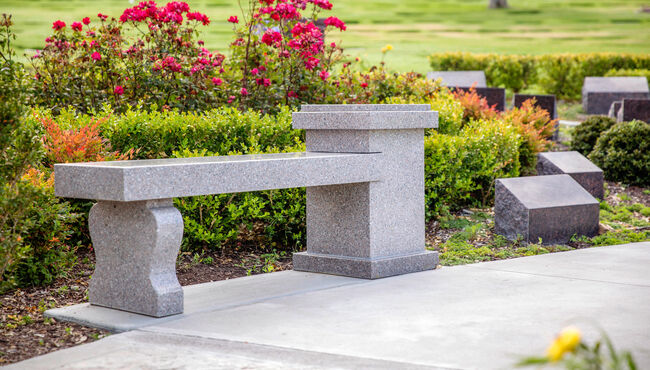 A cremation memorial designed as a bench allows a place for visitors to rest and reflect at Pacific View Memorial Park.