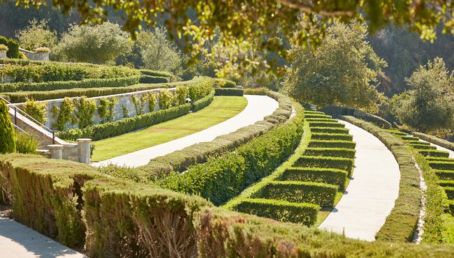 Tiered hedge estates with beautiful landscaping at Rose Hills. 