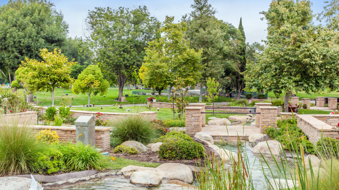 Water fountain with cemetery grounds in the background at Westminster Memorial Park
