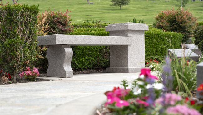 Cremation bench in a Cremation Garden with a pathway.