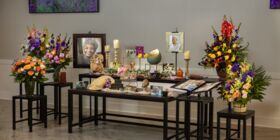 A Memory Table is decorated with pictures and memorabilia, honoring a woman at her celebration of life