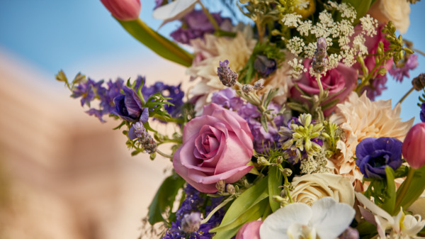 Close up view of the flowers on a memorial wreath on a stand at Pacific View