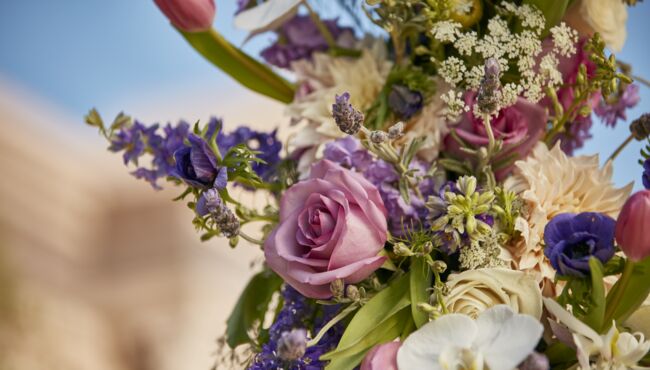 Close up view of the flowers on a memorial wreath on a stand at Pacific View