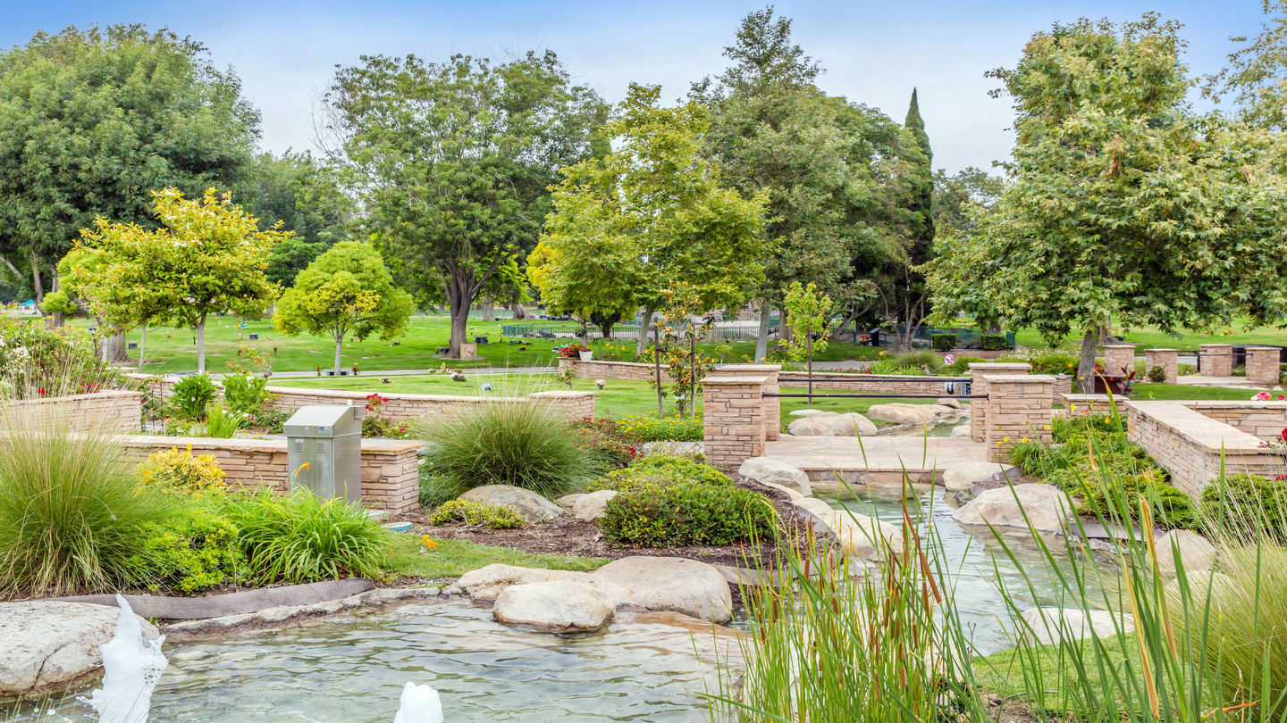 Water fountain with cemetery grounds in the background at Westminster Memorial Park
